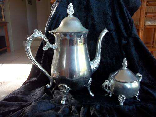 Beautiful old matching silver plated teapot and sugar basin on decorative feet