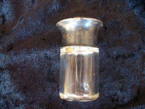 Small antique scent bottle with hallmarked silver lid