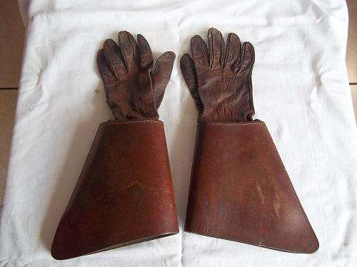 Vintage pair of leather traffic officer gloves with sleeve protectors.