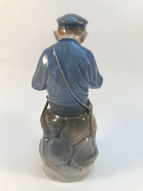 Royal Copenhagen Boy Cutting Stick #905