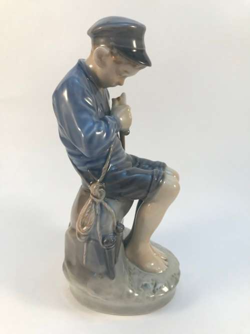Royal Copenhagen Boy Cutting Stick #905