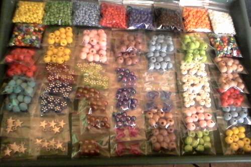 60pkts ..to get all in photos...wooden beads, acrylic beads,seedbeads and star charms,acrylic butter