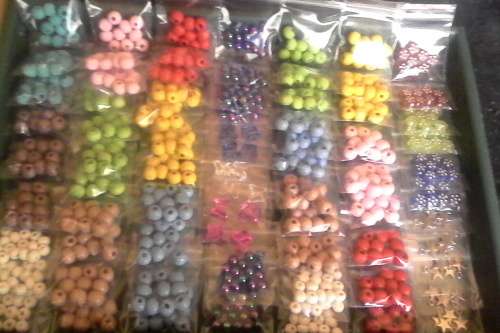 75pkts ..to get all in photos...wooden beads(8mm), acrylic beads,and star charms,acrylic butter