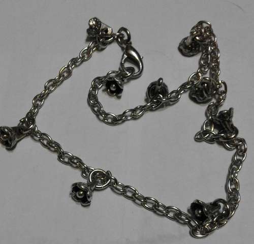 Ankle bracelet...small flower petals...chain adjustable for your size.