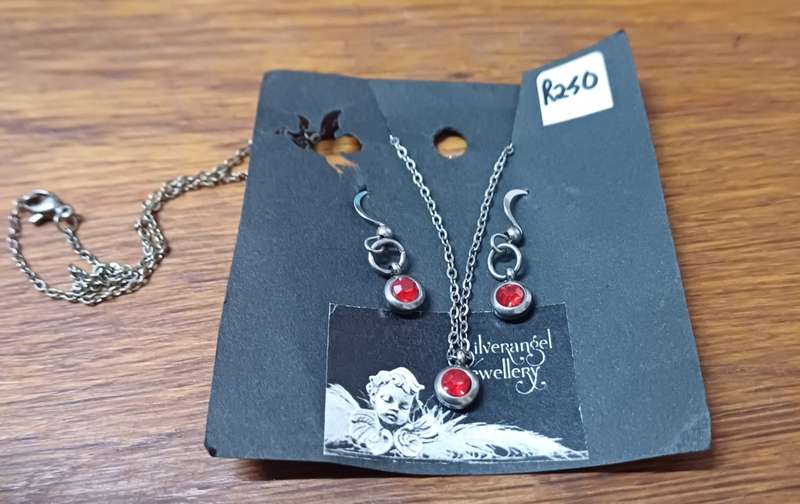 Titanium necklace and earring set with ruby  cz