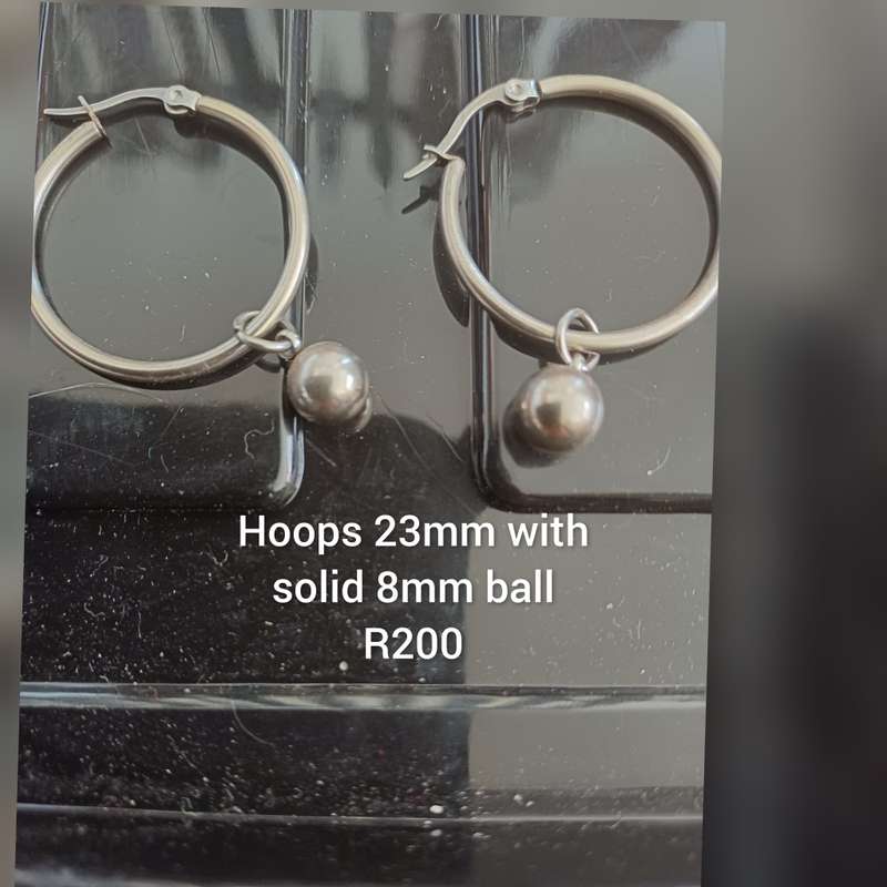 Titanium hoop with solid 6mm ball earrings per pair.
