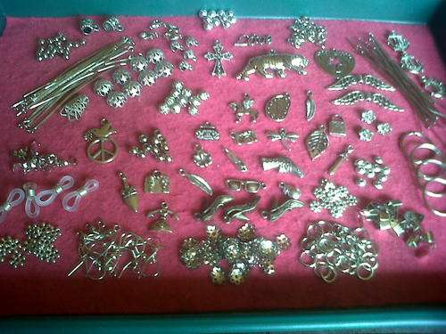 Metal mix with pendants,charms, etc(Bid on 40pkts for whole mix)