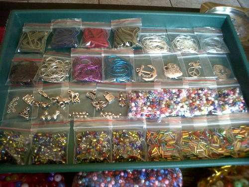 Assorted satin cord,velvet cord,silver foil beads,metal beads,charms,pendants etc