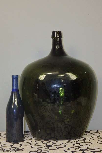 A MAGNIFICENT VINTAGE/ ANTIQUE? HAND BLOWN XL DEMIJOHN GREEN GLASS BOTTLE WITH A LEAD DRAGON