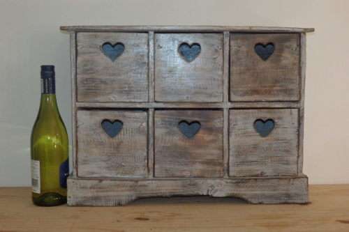 A BEAUTIFUL SOLID WOODEN SIX-DRAWER STORAGE CABINET WITH A GORGEOUS PAINT TECHNIQUED EXTERIOR