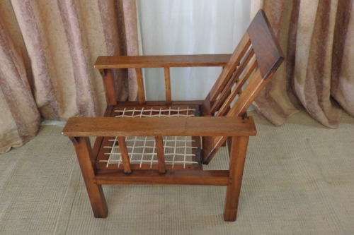 A WONDERFUL VINTAGE (LARGE) SOLID TEAK RIEMPIE CHAIR WITH WITH A FOLD-DOWN BACKTREST