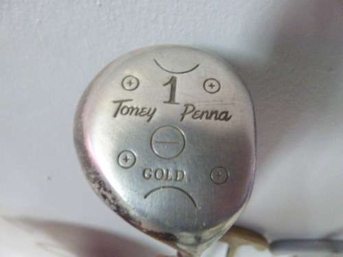 A FANTASTIC RED TONEY PENNA GOLF BAG WITH A TONEY PENNA GOLD 1, TI BUBBLE 2 & 4 PUTTERS.