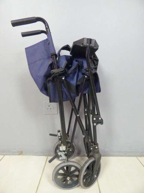 A SUPER LIGHT FOLDING TRANSPORT CHAIR, TRAVEL WHEELCHAIR. GREAT FOR QUICK TRIPS!!