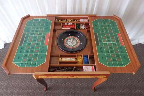A SPECTACULAR RARE MID-CENTURY ITALIAN MADE MARQUETRY GAMES TABLE WITH VARIOUS INLAY BOARD GAMES