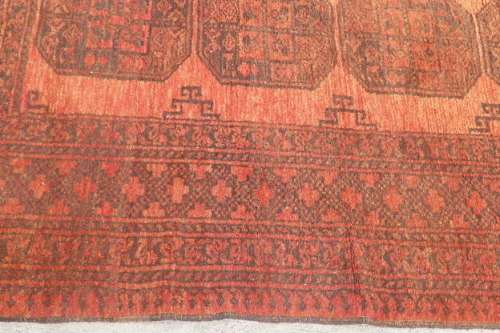 AN INCREDIBLE ANTIQUE PERSIAN CARPET (2.1m x 1.3m) IN EARTHY TONES ENCOMPASSED IN CLARET RED COLOURS