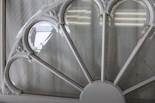 A RARE AND MAGNIFICENT ANTIQUE BEVELED GLASS "PEACOCK" DOUBLE DOOR ARCH TRANSOM WINDOW