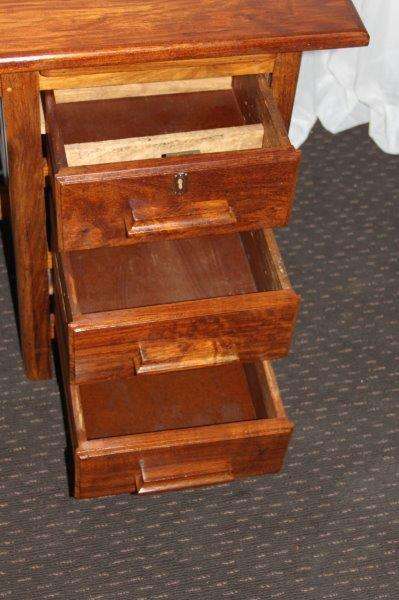 A STUNNING ANTIQUE SOLID TEAK THREE-DRAWER COMPACT OFFICE DESK WITH A PULL-OUT WORK SURFACE
