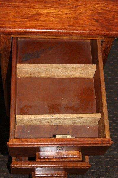 A STUNNING ANTIQUE SOLID TEAK THREE-DRAWER COMPACT OFFICE DESK WITH A PULL-OUT WORK SURFACE