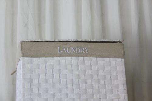 A FABULOUS WHITE LAUNDRY BASKET WITH A NATURAL LINEN (REMOVABLE) EMBROIDERED LINEN BAG