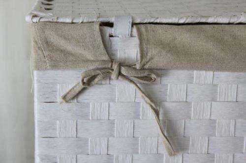 A FABULOUS WHITE LAUNDRY BASKET WITH A NATURAL LINEN (REMOVABLE) EMBROIDERED LINEN BAG