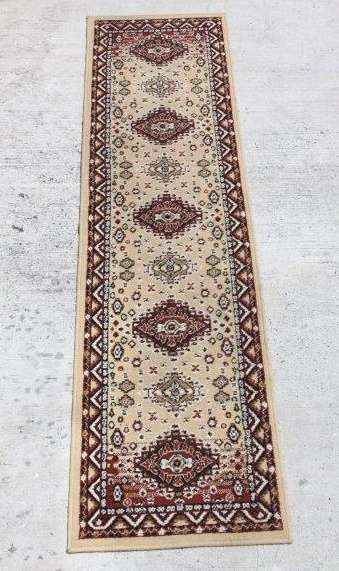 A FABULOUS 2.6m LONG "KHALAF ORIENT" RUNNER CARPET IN DARK BROWN AND TAN COLOURS