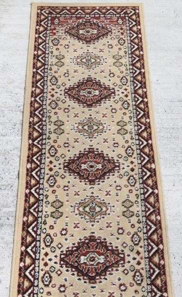 A FABULOUS 2.6m LONG "KHALAF ORIENT" RUNNER CARPET IN DARK BROWN AND TAN COLOURS