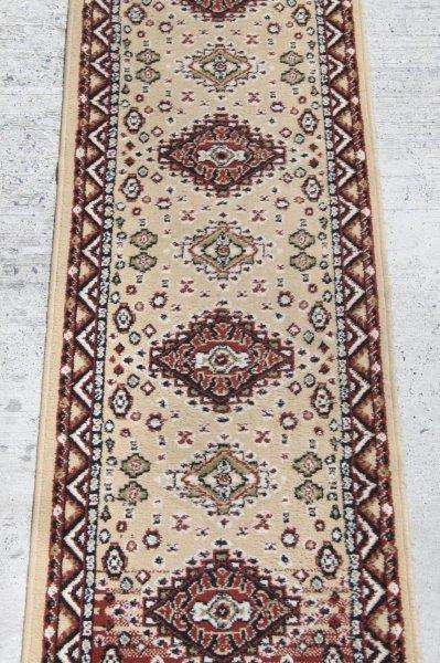 A FABULOUS 2.6m LONG "KHALAF ORIENT" RUNNER CARPET IN DARK BROWN AND TAN COLOURS