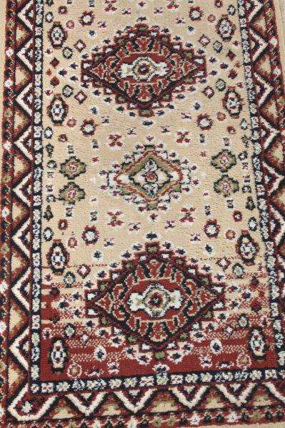 A FABULOUS 2.6m LONG "KHALAF ORIENT" RUNNER CARPET IN DARK BROWN AND TAN COLOURS