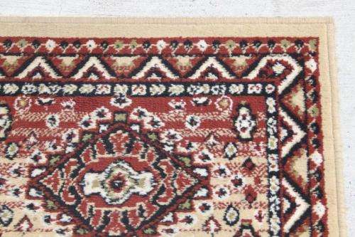 A FABULOUS 2.6m LONG "KHALAF ORIENT" RUNNER CARPET IN DARK BROWN AND TAN COLOURS