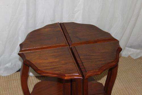 AN AWESOME SOLID TEAK COFFEE TABLE NEST WITH FOUR SMALLER TABLES MAKING A SINGLE LARGER ROUND TABLE