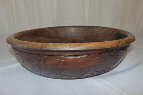 An awesome hand carved African blackwood bowl on a carved tripod stand