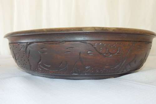 An awesome hand carved African blackwood bowl on a carved tripod stand
