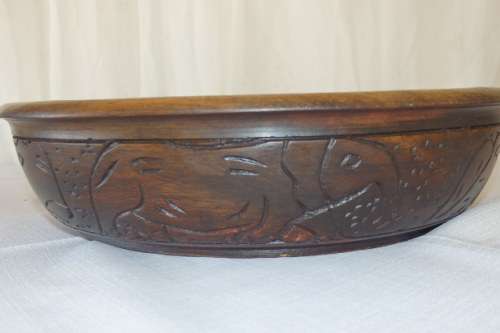 An awesome hand carved African blackwood bowl on a carved tripod stand