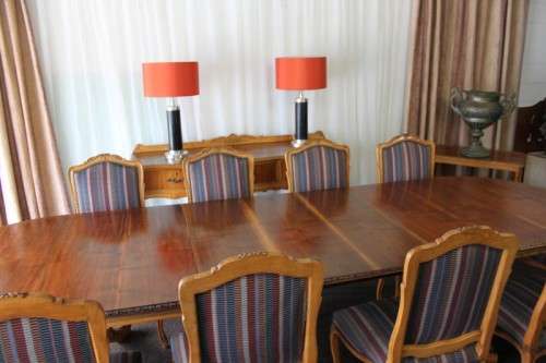 A SPECTACULAR HAND CARVED BURMESE TEAK 10-SEATER DININGROOM SUITE w/ EXTENDING TABLE & CARVER CHAIRS