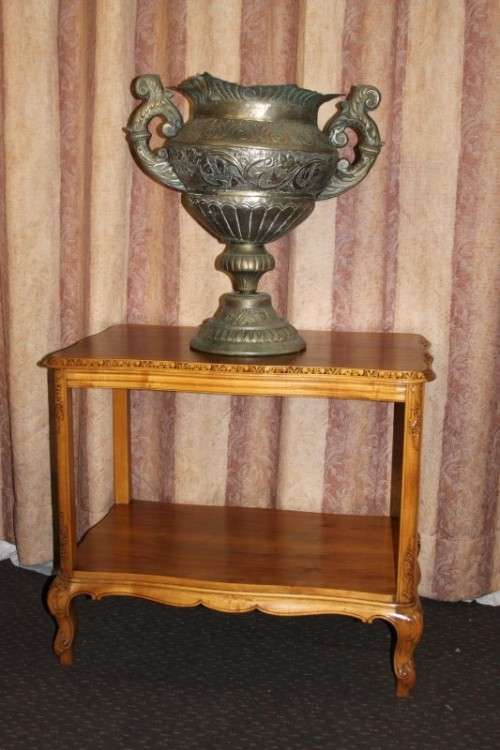 A FANTASTIC BURMESE TEAK DOUBLE SHELF SERVING HATCH TABLE WITH AMAZING HAND CARVED DETAILING