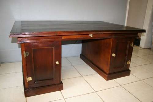 A STUNNING LARGE INDONESIAN TEAK EXECUTIVE "PARTNER" DESK WITH BRASS HANDLES AND HINGES