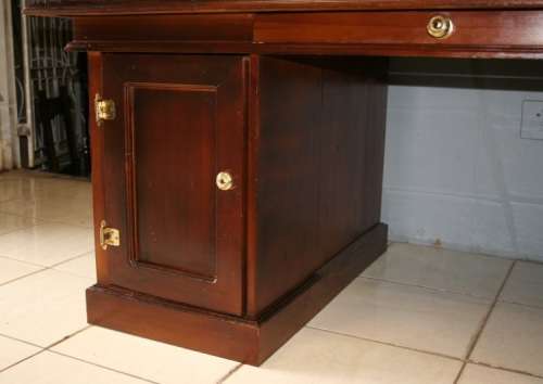 A STUNNING LARGE INDONESIAN TEAK EXECUTIVE "PARTNER" DESK WITH BRASS HANDLES AND HINGES