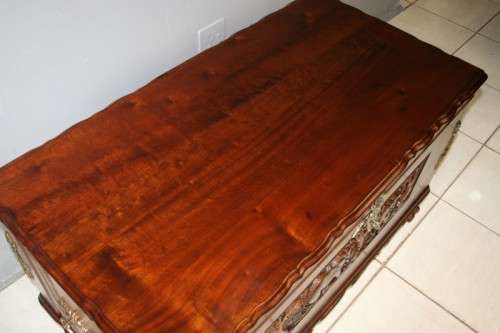 A SPECTACULAR LARGE ANTIQUE SOLID STINKWOOD WOODEN KIST WITH HEAVY BRASS EMBELLISHMENTS