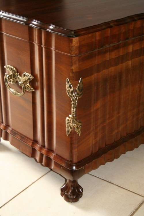A SPECTACULAR LARGE ANTIQUE SOLID STINKWOOD WOODEN KIST WITH HEAVY BRASS EMBELLISHMENTS