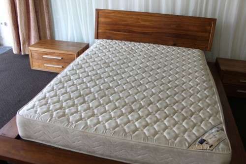 AN INCREDIBLE ORIGINAL WEYLANDTS TEAK BEDROOM SUITE INCLUDING PEDESTALS AND MATTRESS