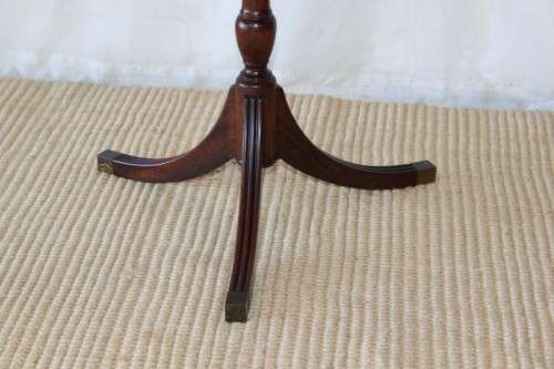 A MAGNIFICENT TEAK OCCASIONAL TABLE WITH BROAD RIMMED DETAILED TOP AND THREE BRASS TOE CAPS
