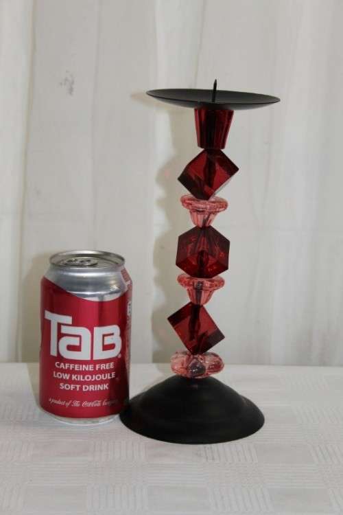 AN AWESOME TALL "MODERN" BLACK METAL CANDLE HOLDER WITH A PINK AND RED BEADED STEM