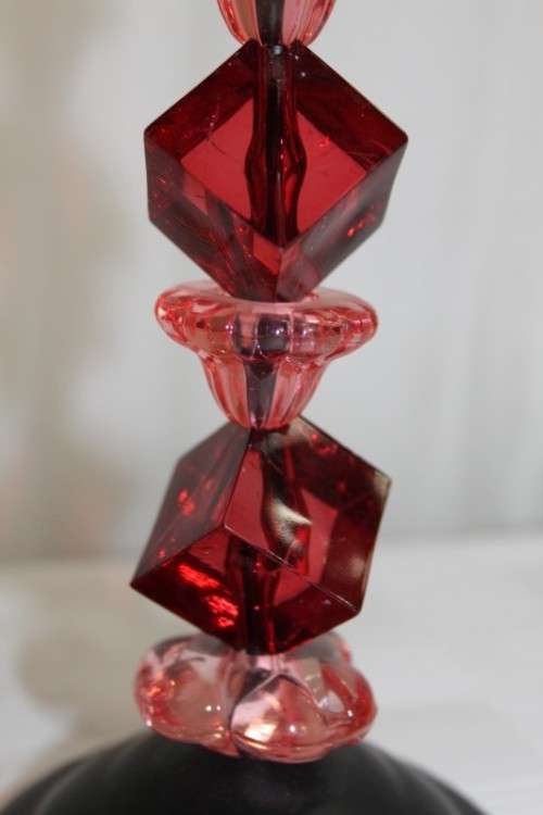 AN AWESOME TALL "MODERN" BLACK METAL CANDLE HOLDER WITH A PINK AND RED BEADED STEM