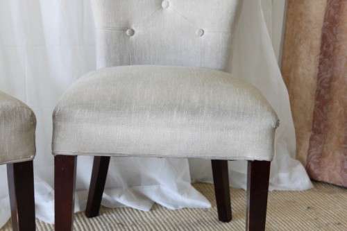 TWO AWESOME MODERN UPHOLSTERED ARC-BACK CHAIRS WITH BUTTON DETAILING bid/chair