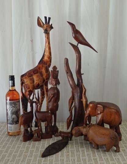 A STUNNING **JOB LOT** OF ASSORTED WOODEN CARVINGS INCLUDING A GENUINE TEAK ELEPHANT WOODEN CARVING