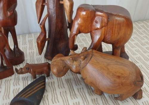 A STUNNING **JOB LOT** OF ASSORTED WOODEN CARVINGS INCLUDING A GENUINE TEAK ELEPHANT WOODEN CARVING