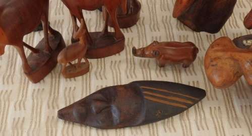 A STUNNING **JOB LOT** OF ASSORTED WOODEN CARVINGS INCLUDING A GENUINE TEAK ELEPHANT WOODEN CARVING