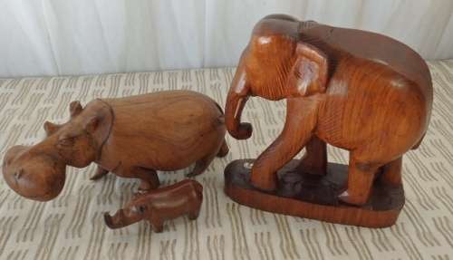 A STUNNING **JOB LOT** OF ASSORTED WOODEN CARVINGS INCLUDING A GENUINE TEAK ELEPHANT WOODEN CARVING