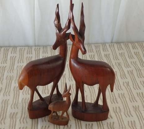A STUNNING **JOB LOT** OF ASSORTED WOODEN CARVINGS INCLUDING A GENUINE TEAK ELEPHANT WOODEN CARVING