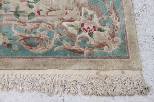 A WONDERFUL ANTIQUE PURE WOOL PILE CARPET (2.9m x 1.8m) WITH GREENS, PINKS, TANS AND EARTHY TONES